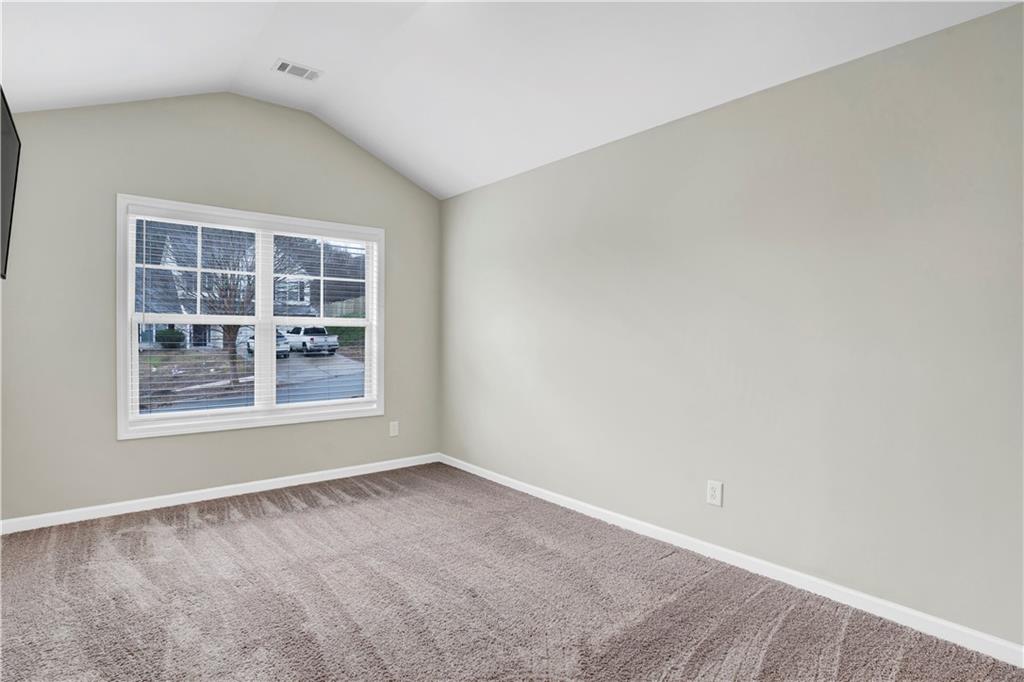 7789 Village Pass Fairburn, GA 30213 - Photo 32 of 35 an empty room with windows