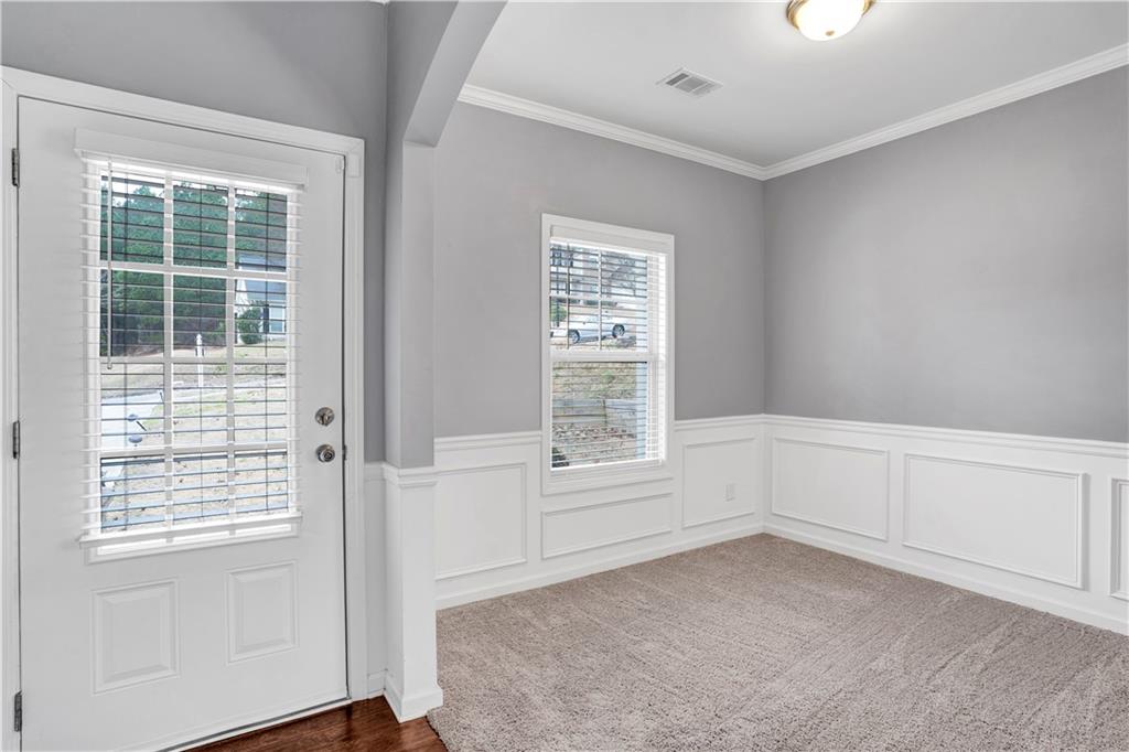 7789 Village Pass Fairburn, GA 30213 - Photo 6 of 35 an empty room with windows