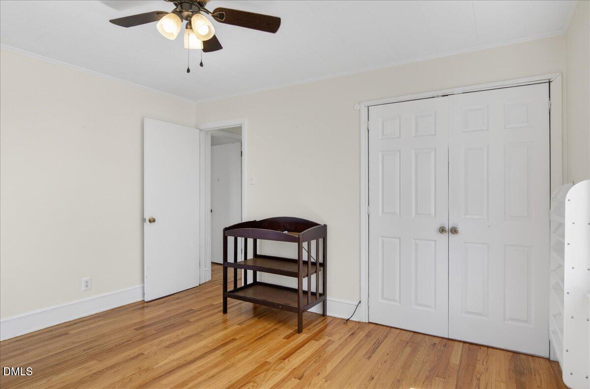 2118 Nutbush Road Henderson, NC 27537 - Photo 23 of 61 wooden floor in an empty room with a window
