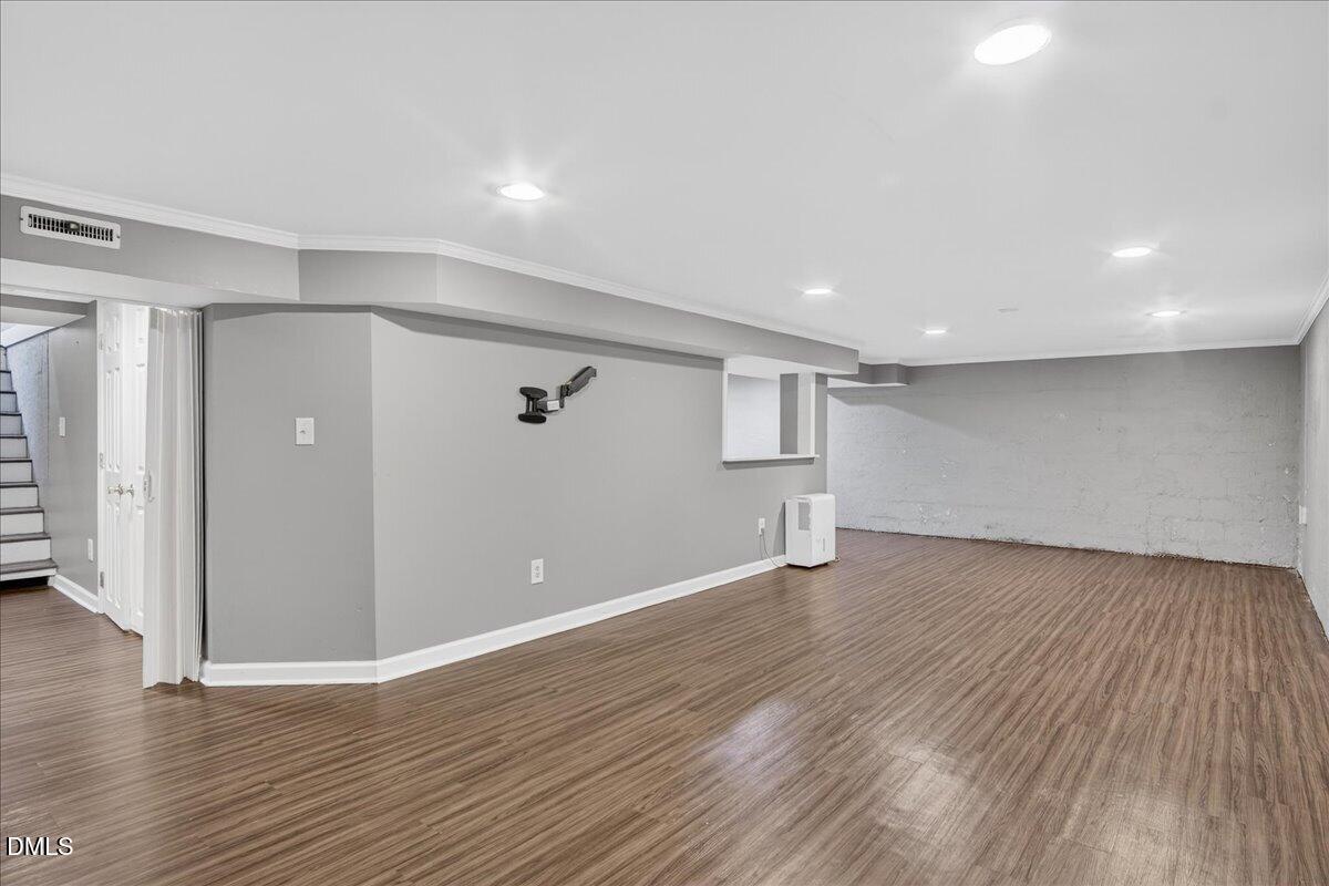 2118 Nutbush Road Henderson, NC 27537 - Photo 31 of 61 a view of an empty room with wooden floor