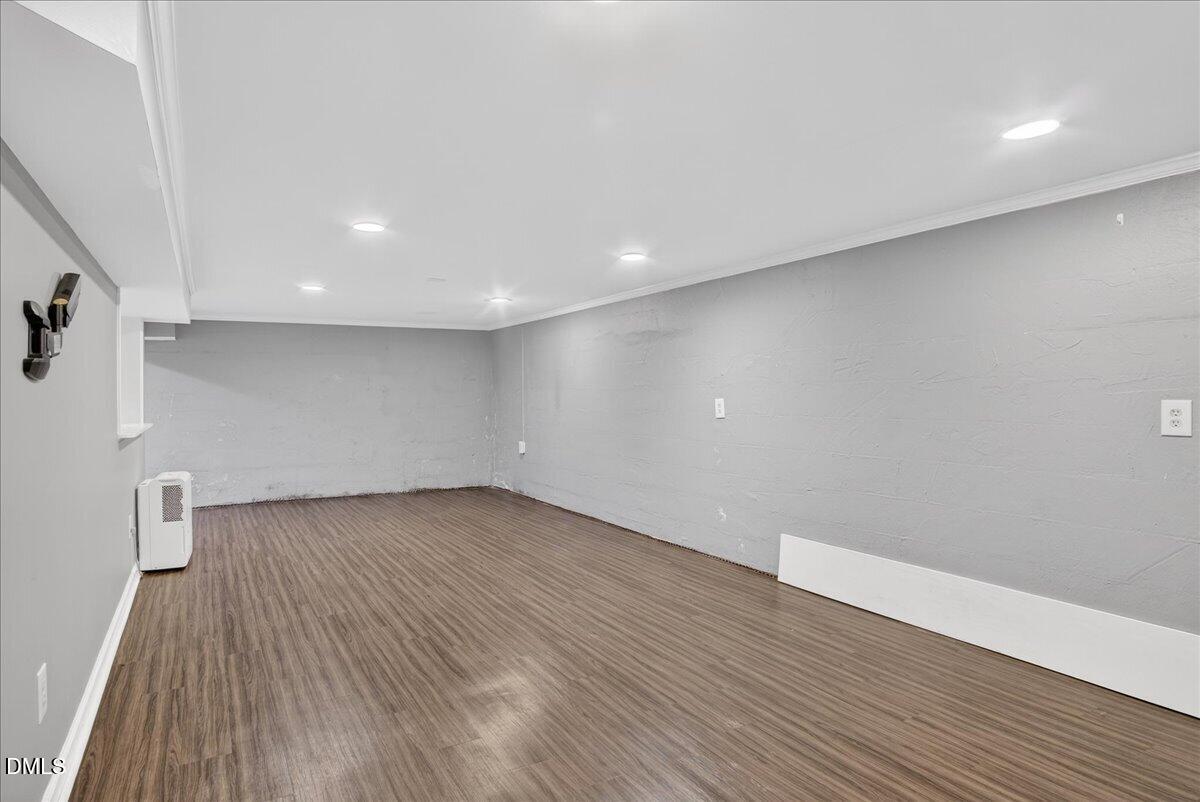 2118 Nutbush Road Henderson, NC 27537 - Photo 32 of 61 a view of an empty room with wooden floor