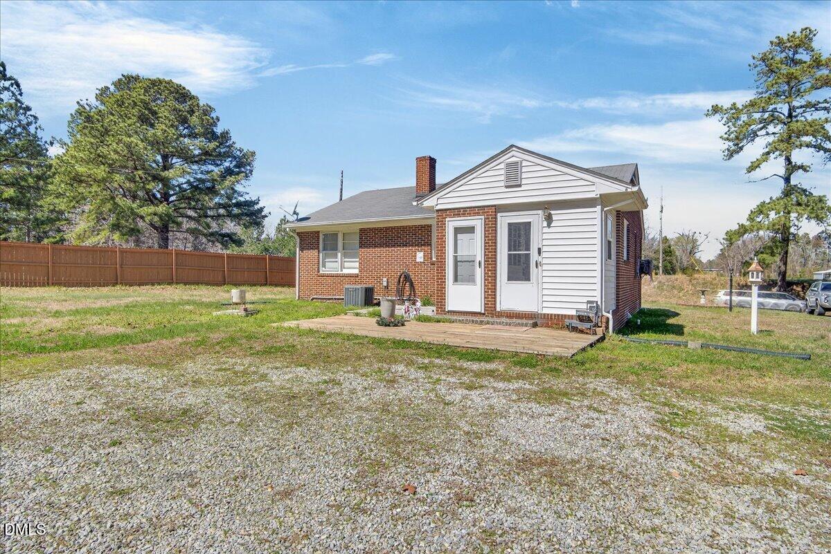 2118 Nutbush Road Henderson, NC 27537 - Photo 44 of 61 a view of a house with backyard and a tree