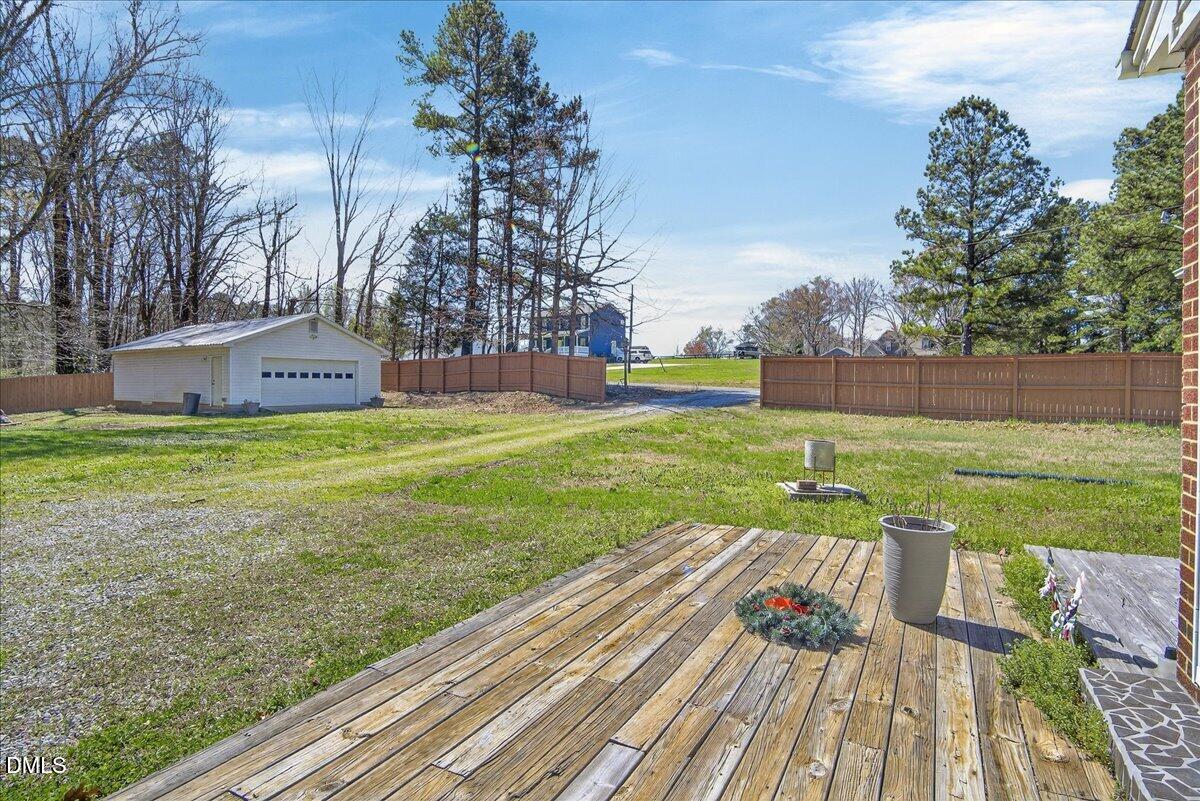 2118 Nutbush Road Henderson, NC 27537 - Photo 46 of 61 a view of a deck with a yard