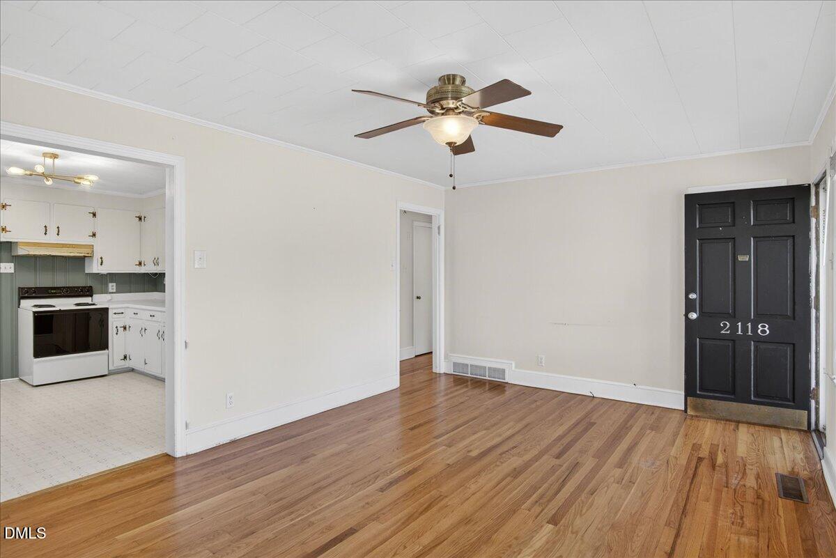 2118 Nutbush Road Henderson, NC 27537 - Photo 6 of 61 a view of an empty room with wooden floor