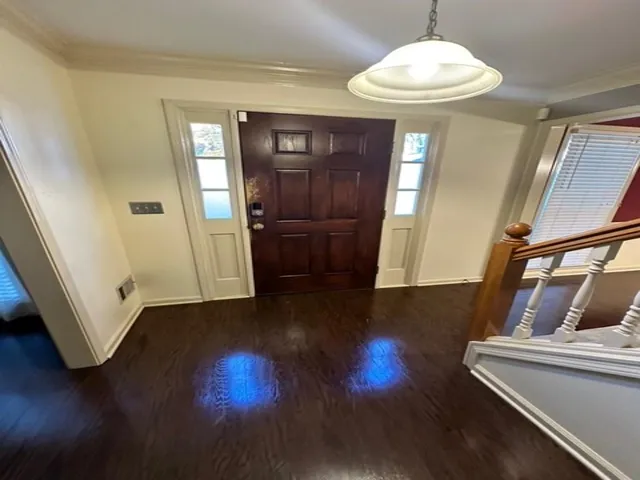 a view of entryway with wooden floor