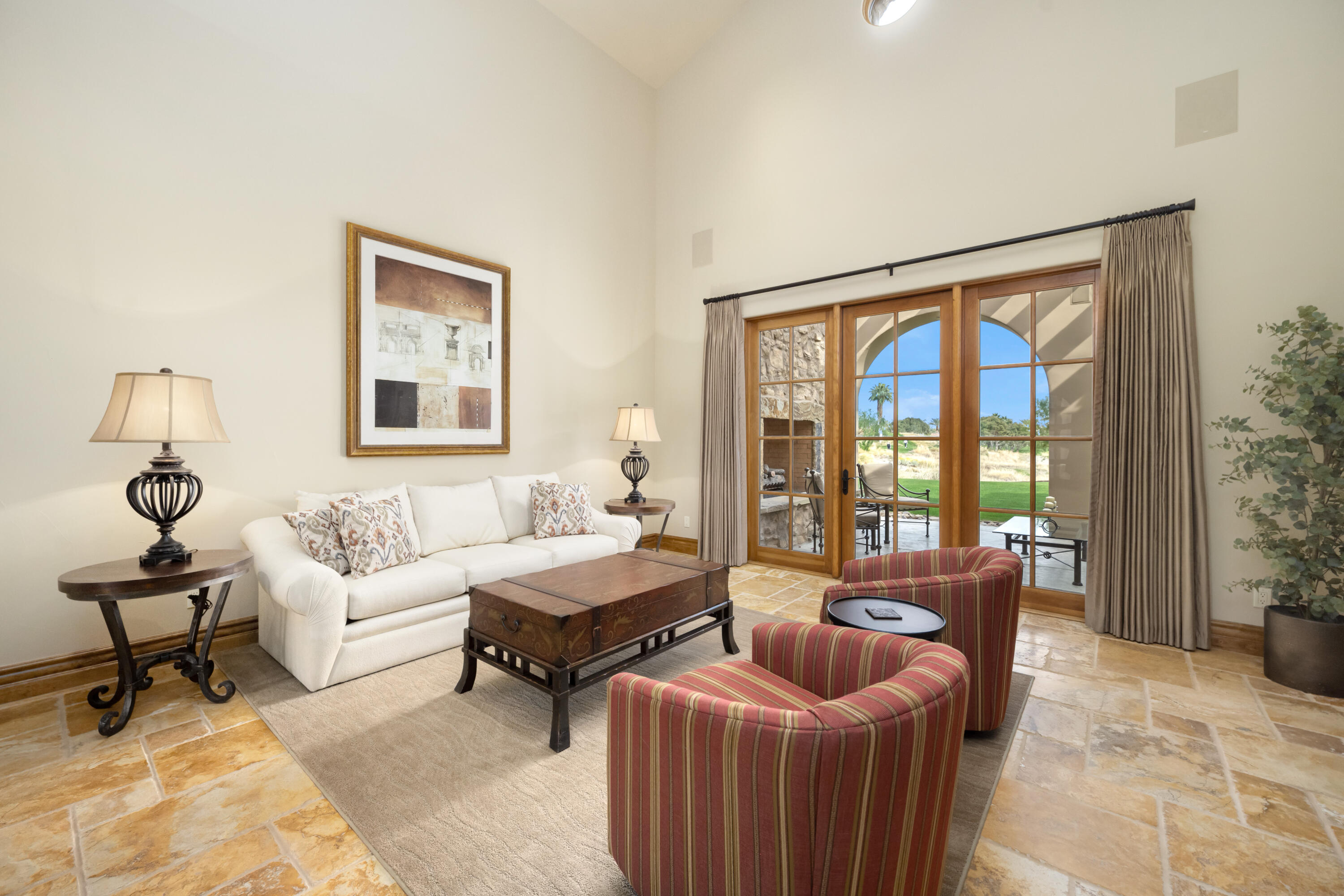 52844 Via Dona La Quinta, CA 92253 - Photo 13 of 46 a living room with furniture and floor to ceiling windows