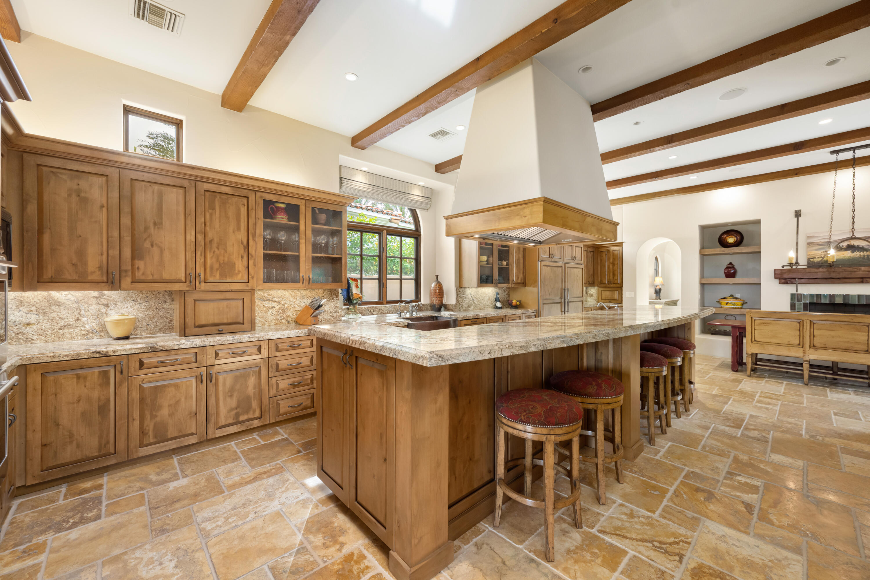 52844 Via Dona La Quinta, CA 92253 - Photo 15 of 46 a kitchen with kitchen island granite countertop wooden cabinets and counter space