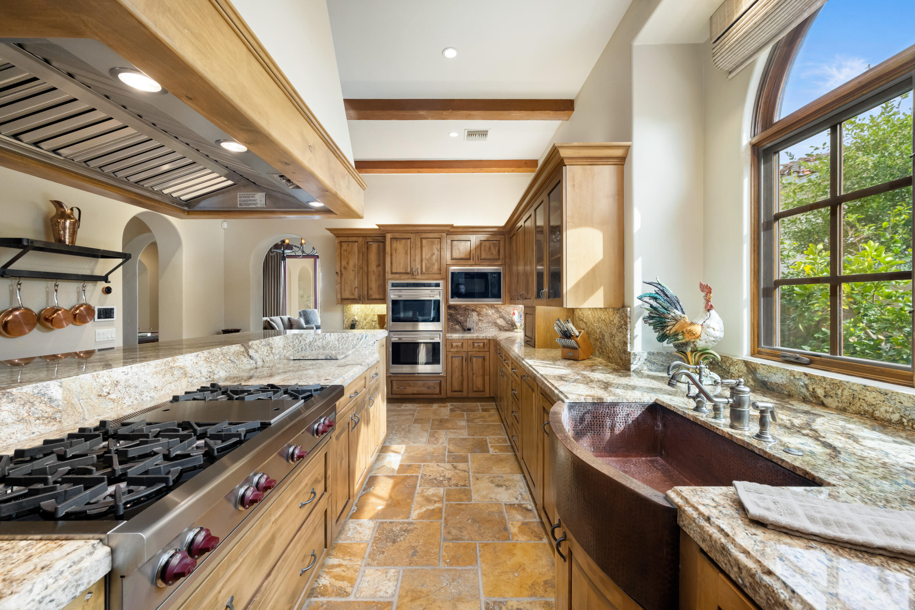 52844 Via Dona La Quinta, CA 92253 - Photo 17 of 46 a large kitchen with stainless steel appliances granite countertop a lot of counter space and a sink