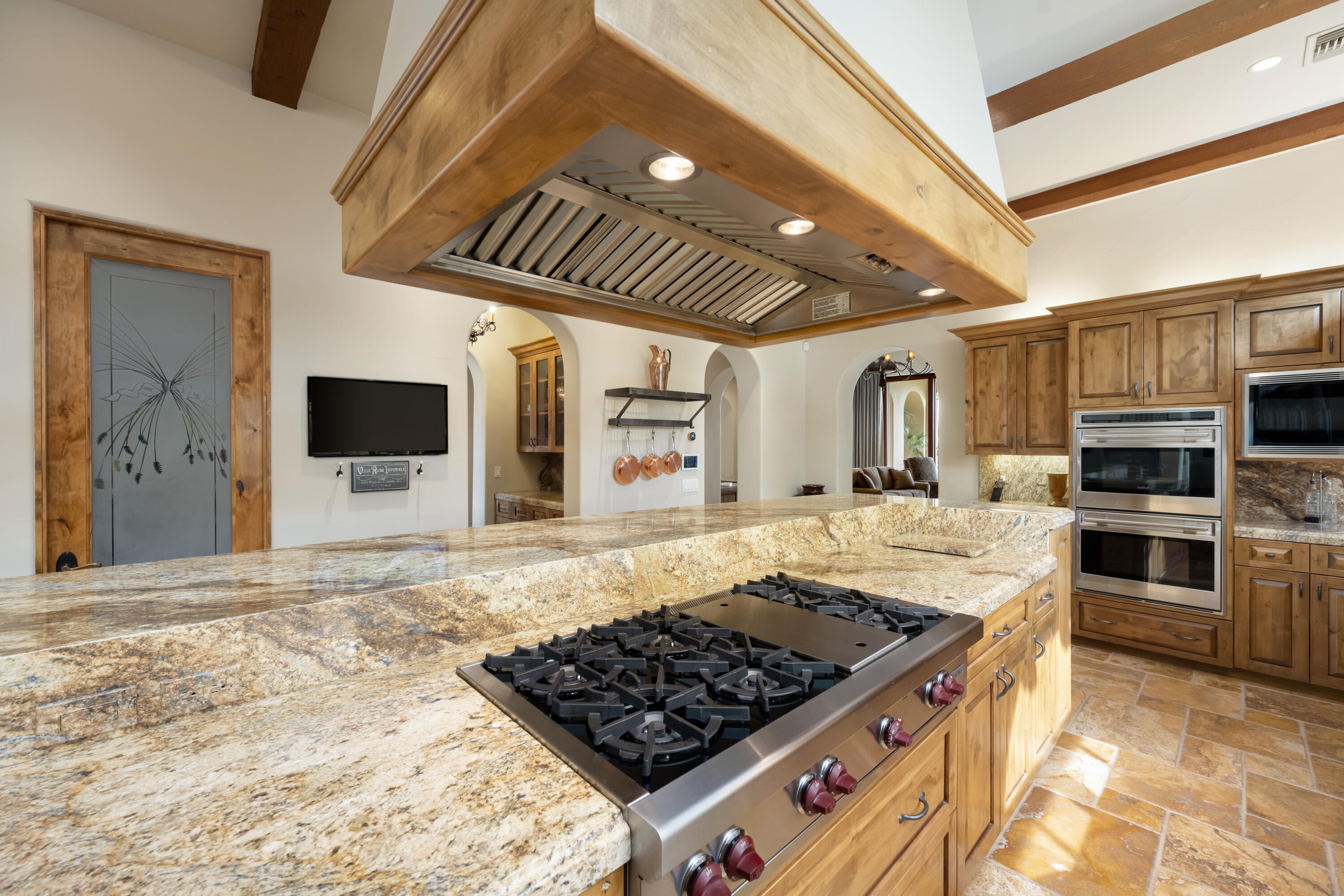 52844 Via Dona La Quinta, CA 92253 - Photo 18 of 46 a kitchen with stainless steel appliances granite countertop a stove and a sink