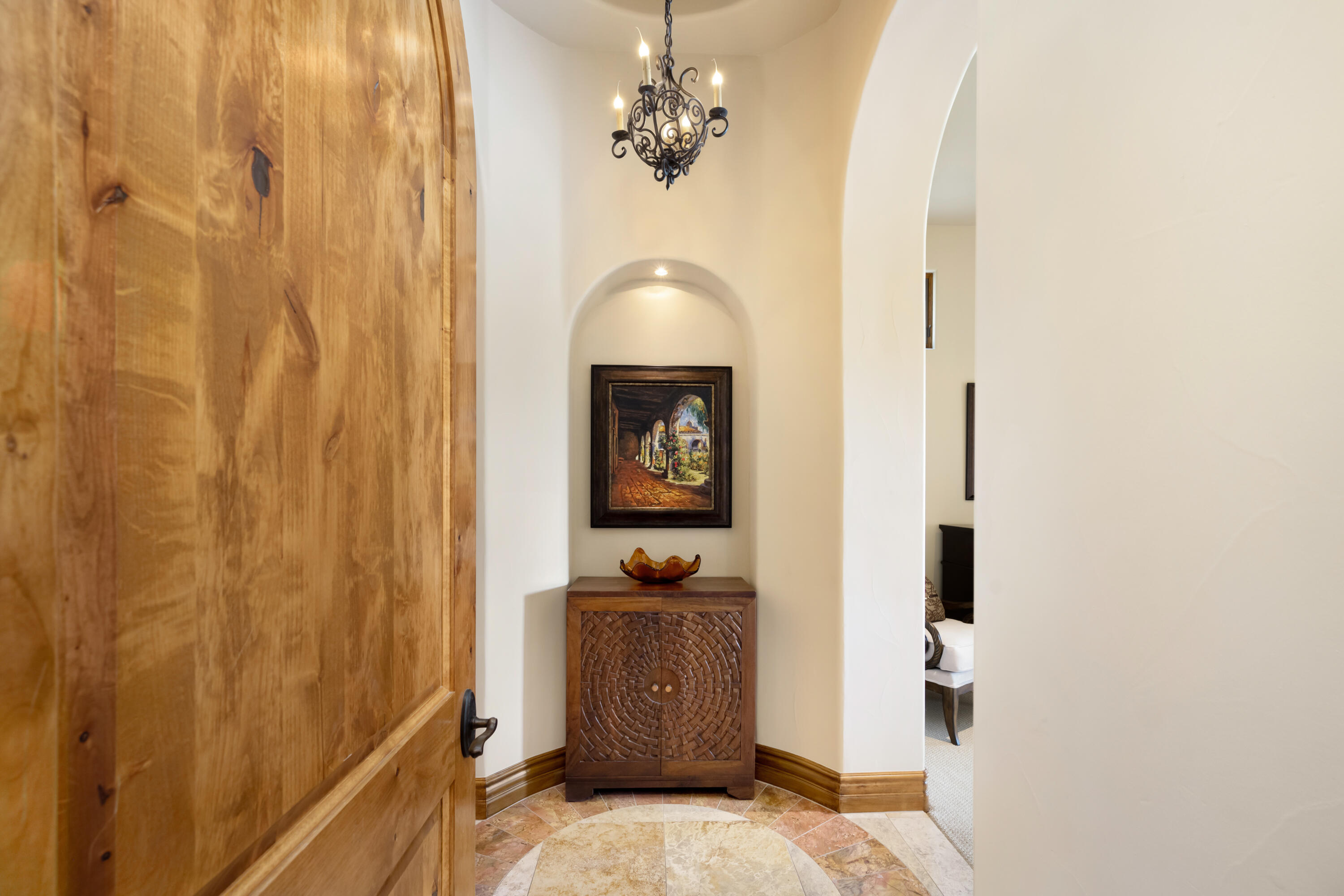 52844 Via Dona La Quinta, CA 92253 - Photo 24 of 46 a bedroom with a bed and a chandelier fan