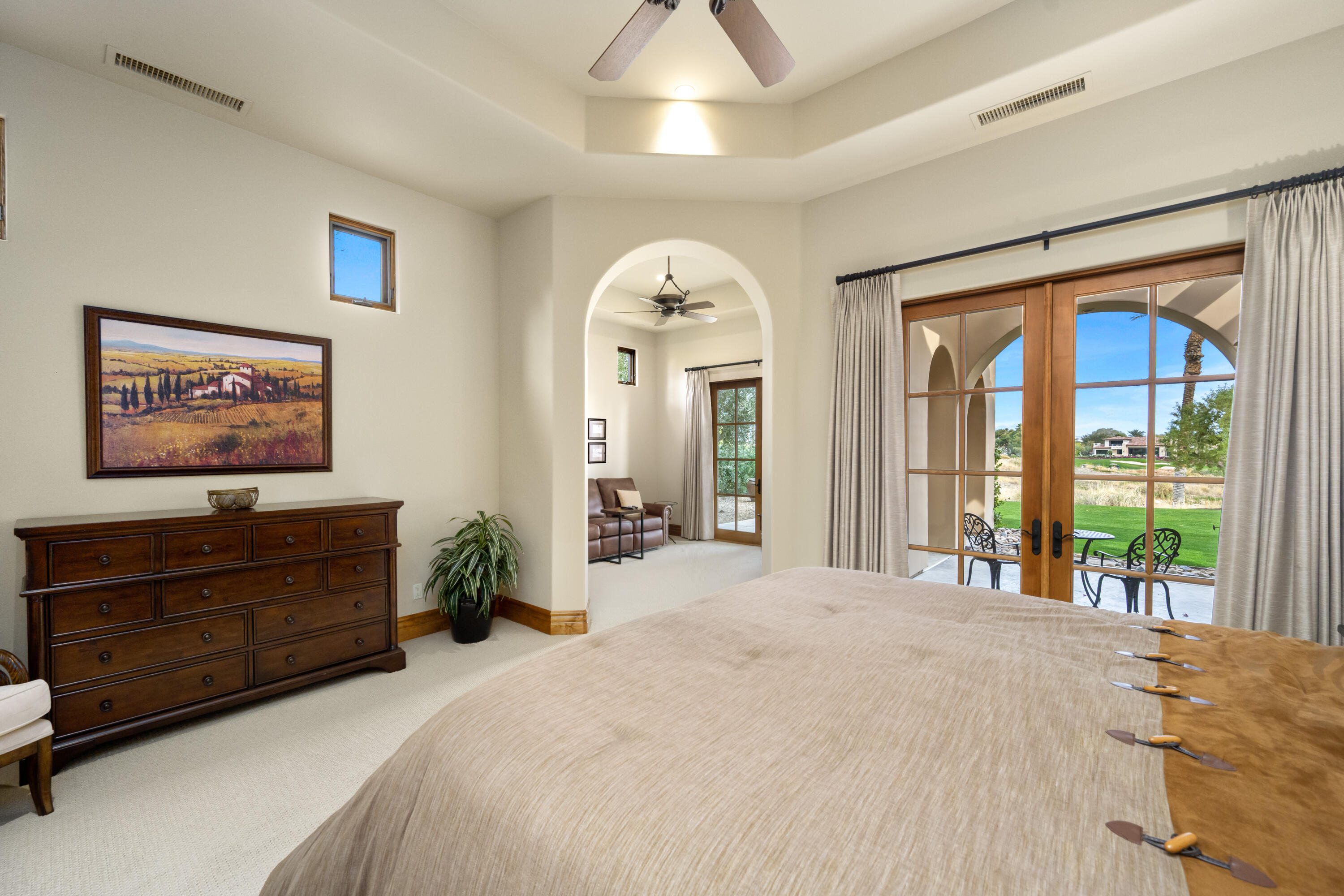 52844 Via Dona La Quinta, CA 92253 - Photo 26 of 46 a spacious bedroom with a bed and a dresser