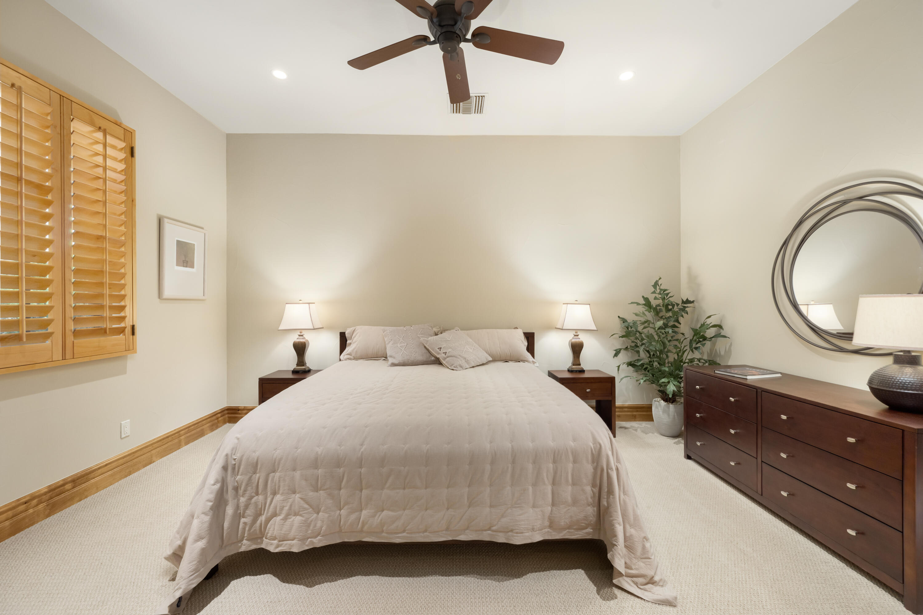 52844 Via Dona La Quinta, CA 92253 - Photo 37 of 46 a bedroom with a bed and a potted plant