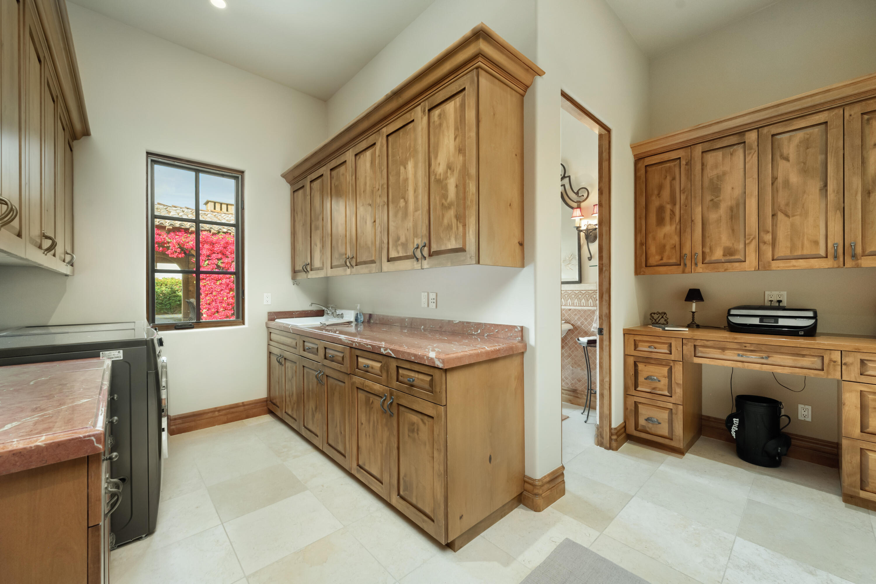 52844 Via Dona La Quinta, CA 92253 - Photo 39 of 46 a kitchen with stainless steel appliances granite countertop a stove a sink and a refrigerator