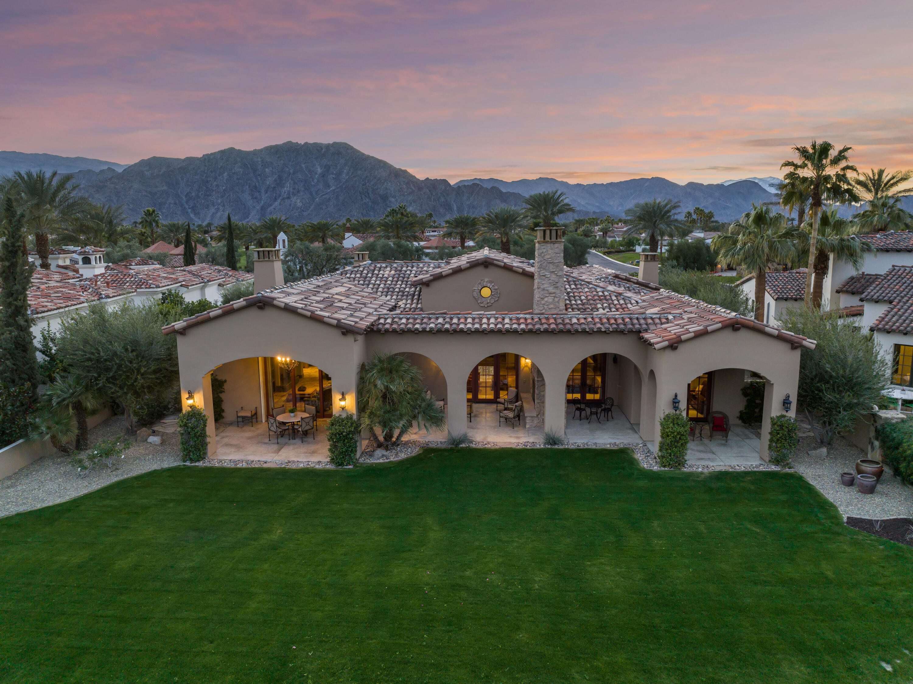 52844 Via Dona La Quinta, CA 92253 - Photo 42 of 46 a view of a couches and a table and chairs in the garden