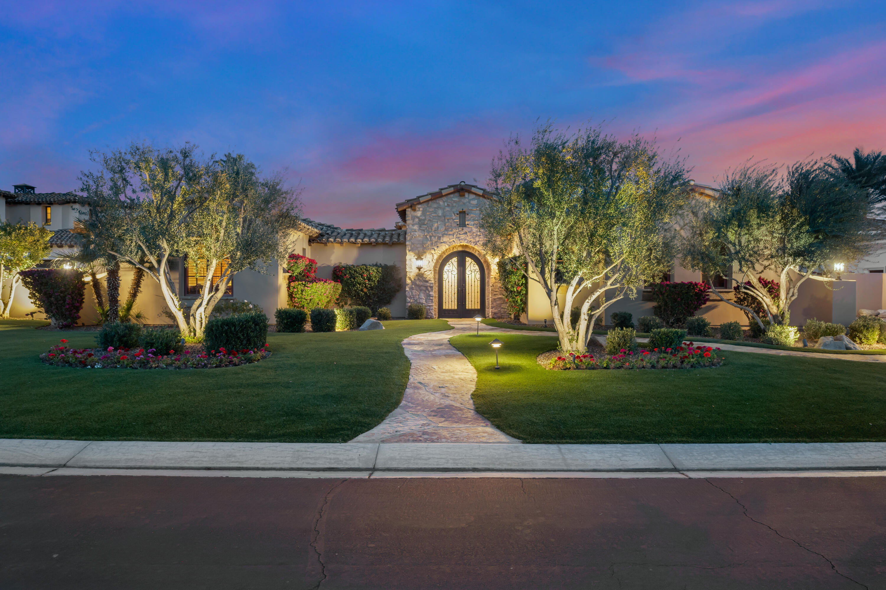 52844 Via Dona La Quinta, CA 92253 - Photo 45 of 46 a front view of a house with a yard and a garage