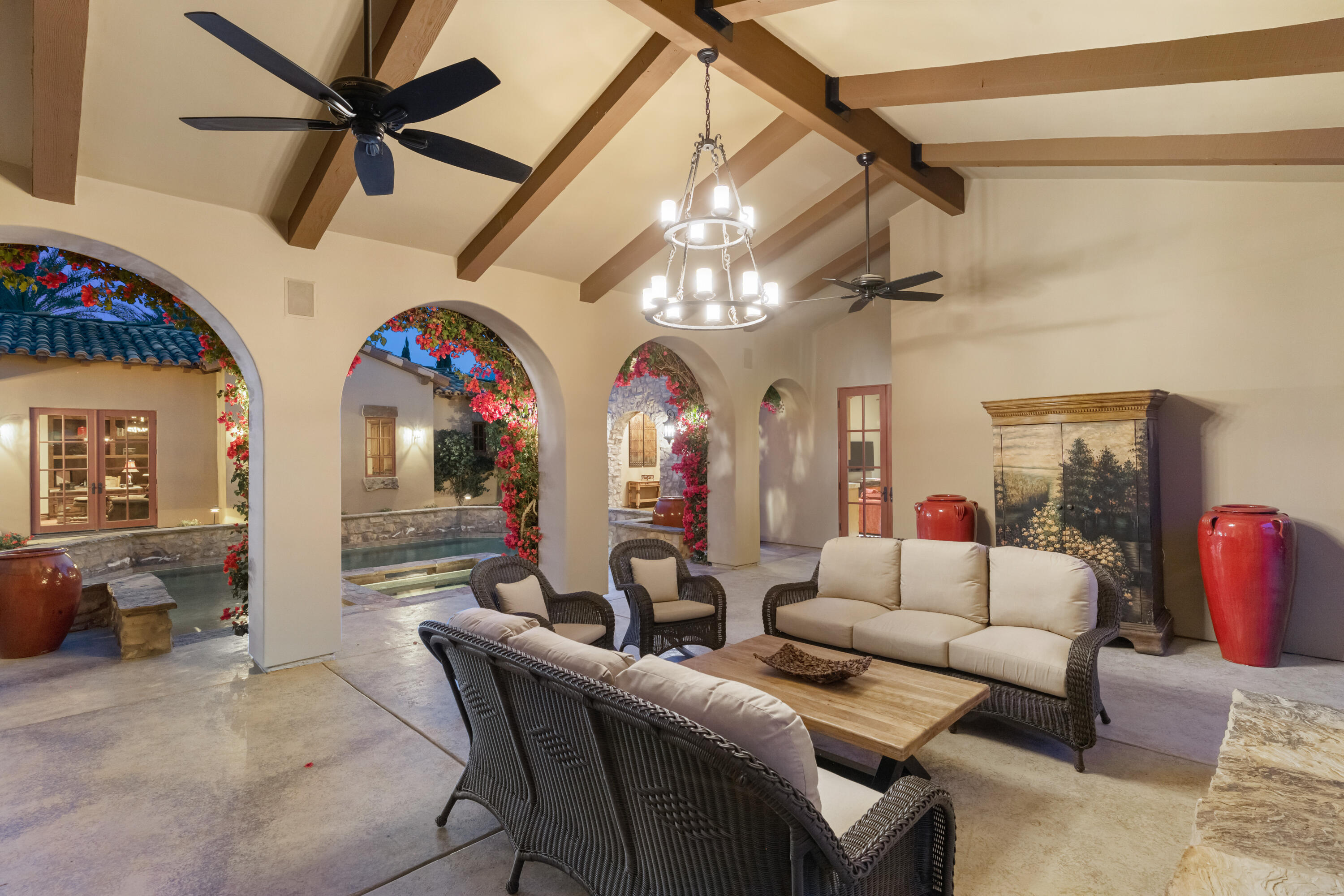 52844 Via Dona La Quinta, CA 92253 - Photo 10 of 46 a living room with furniture a chandelier and a flat screen tv