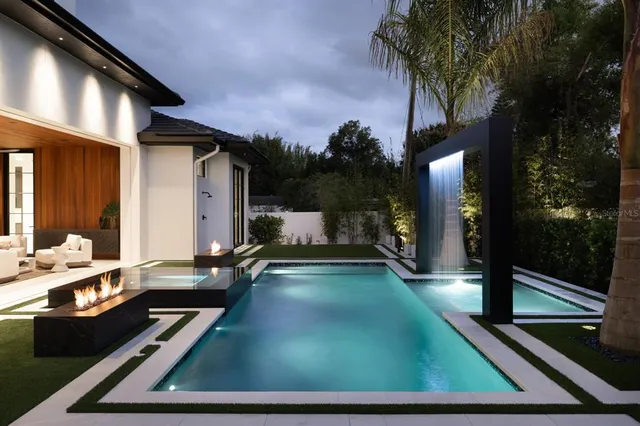 a view of swimming pool with patio