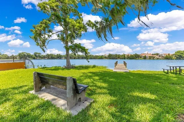 a view of swimming pool with a table and chairs