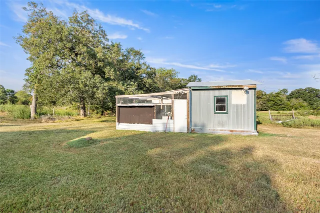 a view of a lake with houses in the back