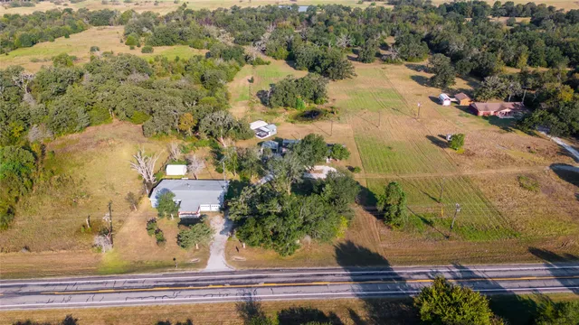 an aerial view of residential house with outdoor space