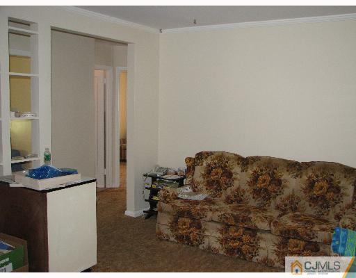 54 Coldevin Road Clark, NJ 07066 - Photo 2 of 8 a bedroom with bed and a window