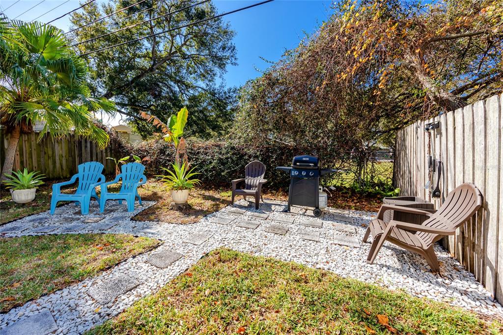 5596 100th Way North St. Petersburg, FL 33708 - Photo 59 of 67 a view of a backyard with sitting area