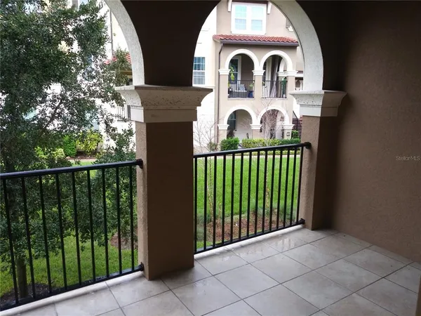 a view of a patio with table and chairs potted plants with wooden floor