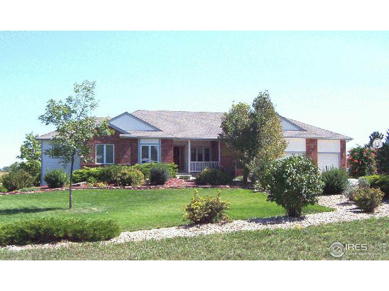 7326 North 115th Street Longmont, CO 80504 - Photo 1 of 6 a front view of a house with a yard