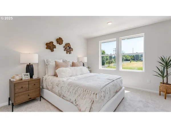 a bedroom with a bed and window