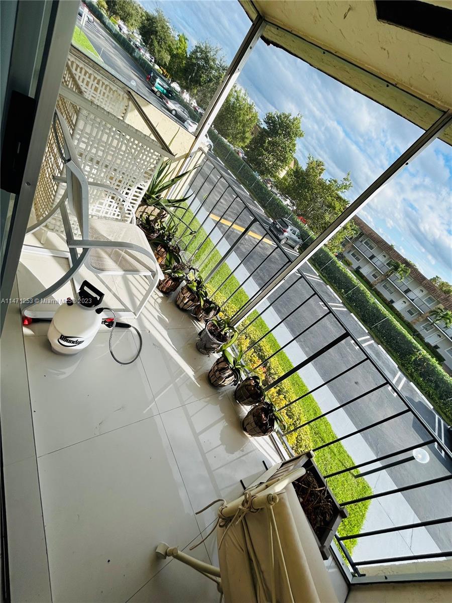 22795 Southwest 66th Avenue, Unit 205 Boca Raton, FL 33428 - Photo 25 of 33 a view of backyard with sitting area