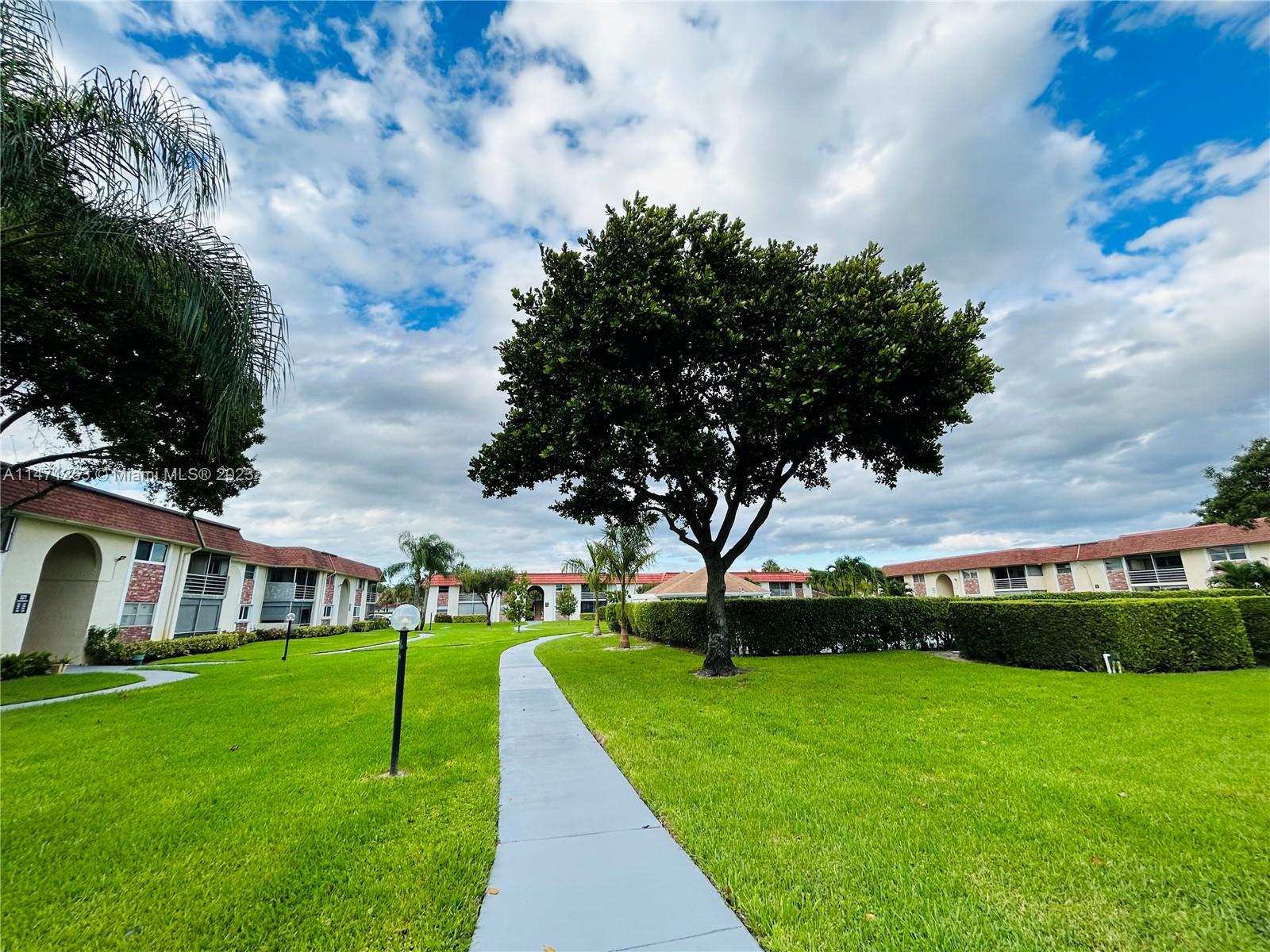 22795 Southwest 66th Avenue, Unit 205 Boca Raton, FL 33428 - Photo 26 of 33 a view of house with garden