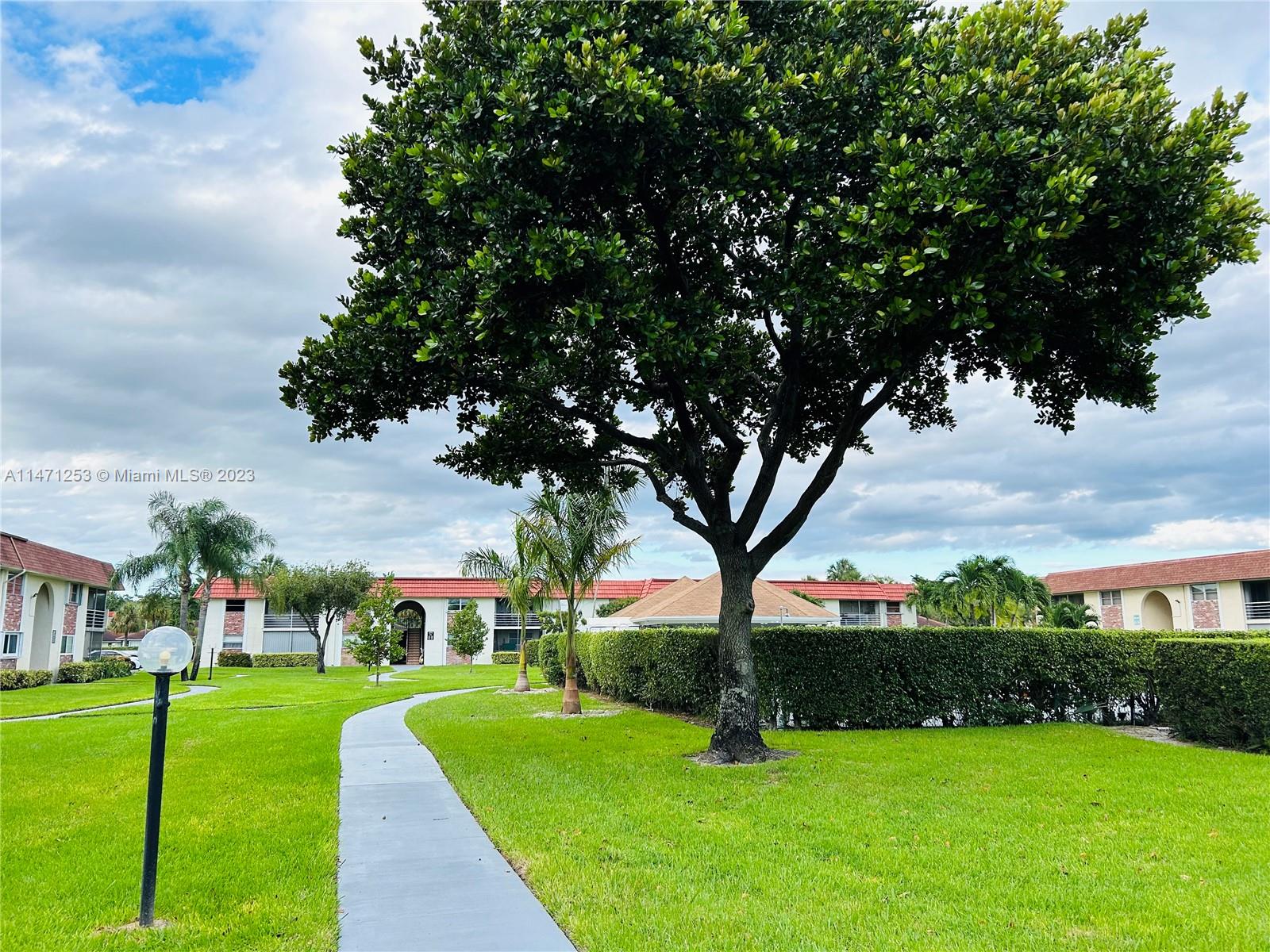 22795 Southwest 66th Avenue, Unit 205 Boca Raton, FL 33428 - Photo 27 of 33 a view of a park with large trees