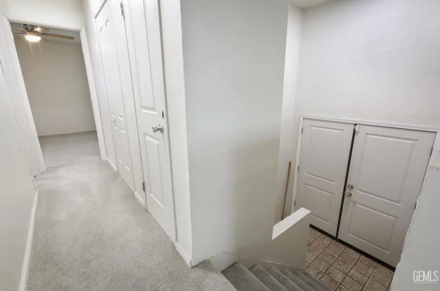 an empty room with a empty space and windows