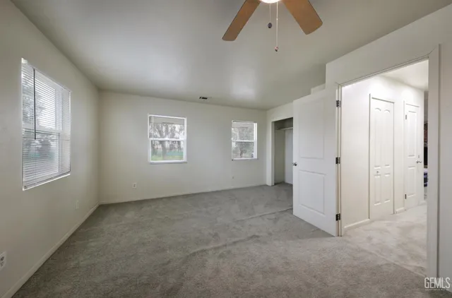 a bathroom with a sink toilet and a mirror