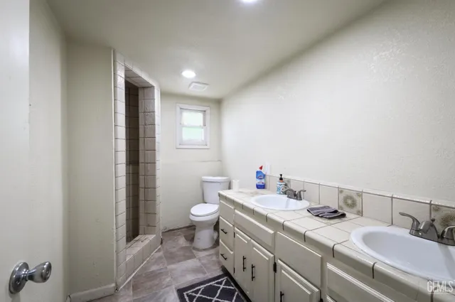 a view of a kitchen with appliances and cabinets