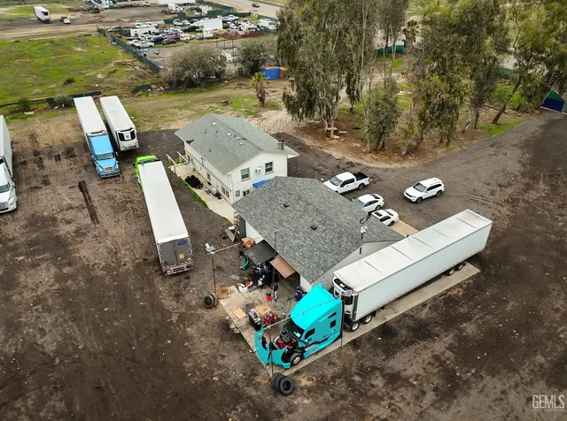 an aerial view of a house with outdoor space