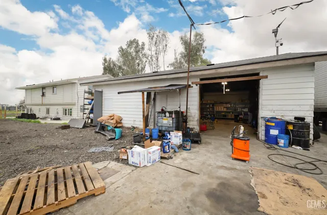 a view of a back yard with patio