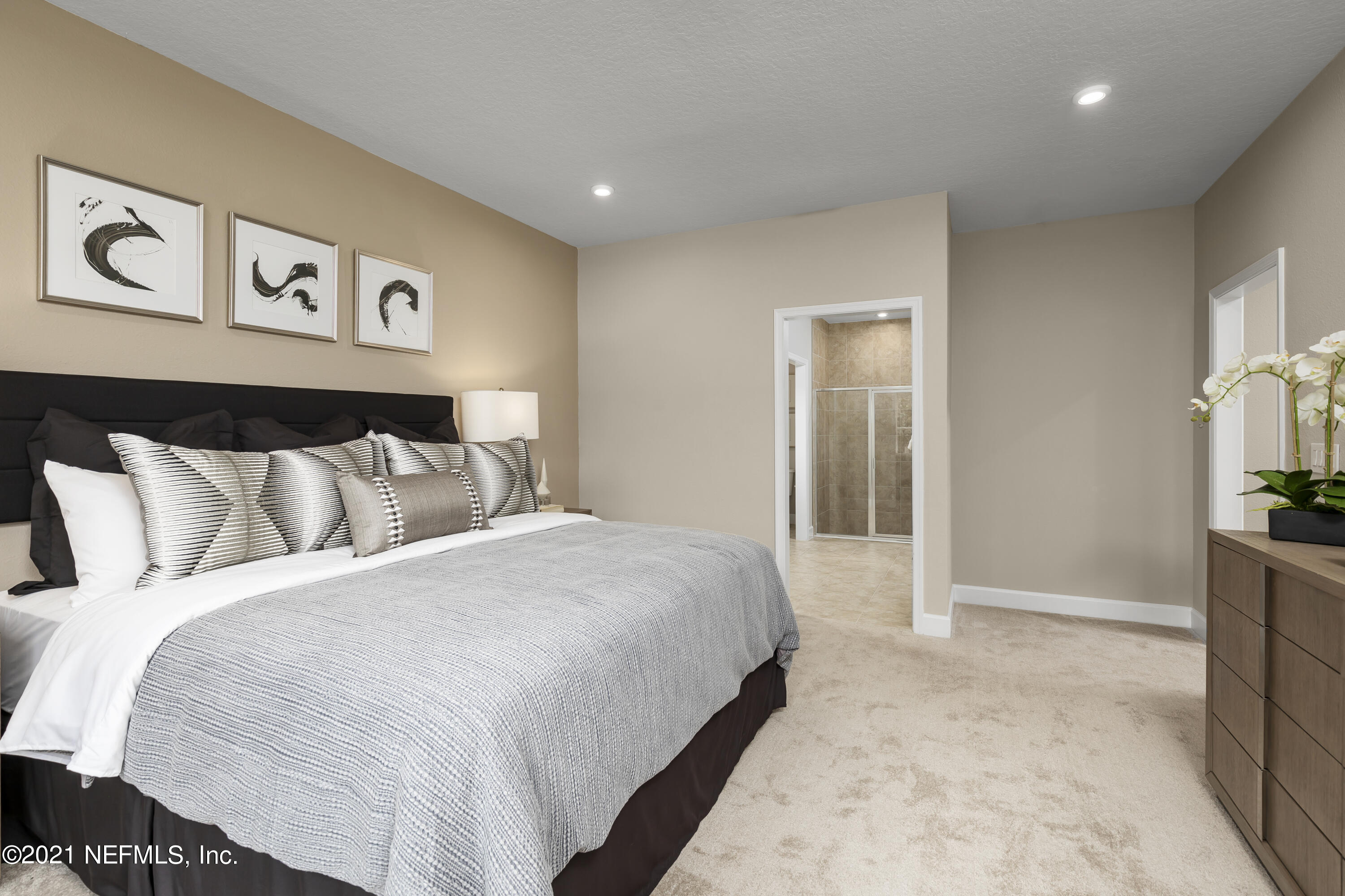 1339 Tan Tara Trail Jacksonville, FL 32221 - Photo 16 of 18 a bedroom with a large bed and painting on the wall