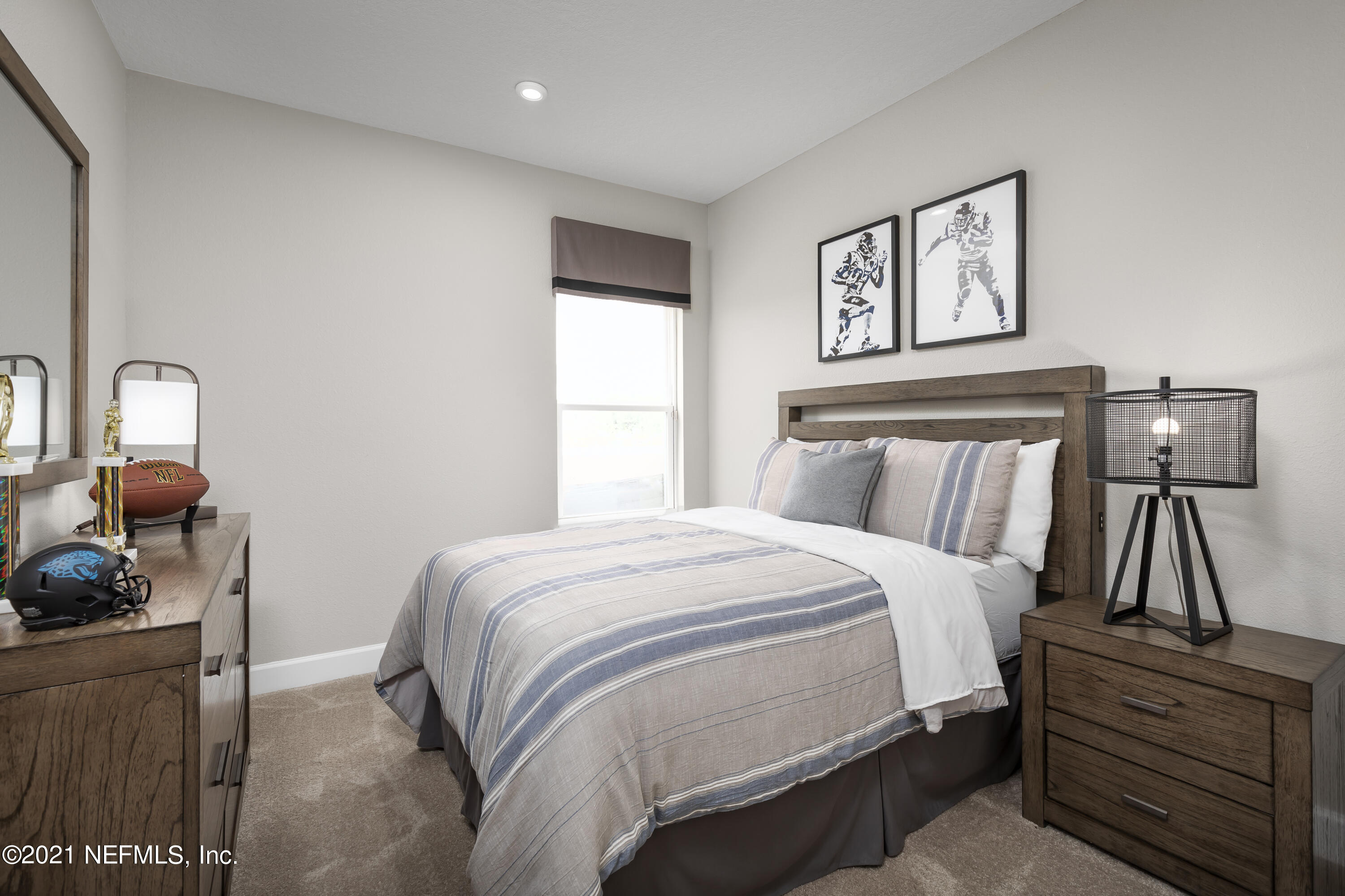 1339 Tan Tara Trail Jacksonville, FL 32221 - Photo 4 of 18 a bedroom with a bed and wooden floor