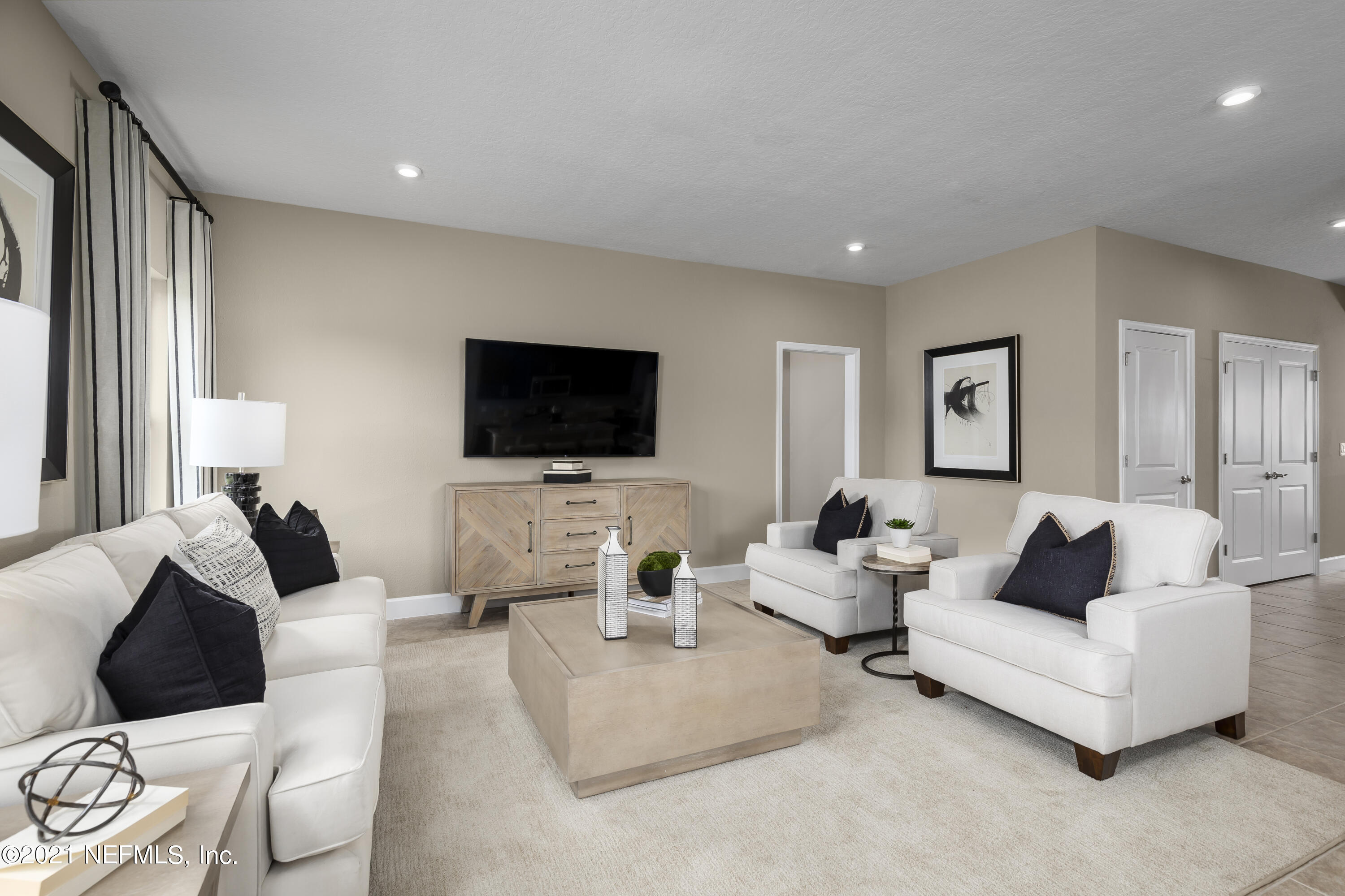 1339 Tan Tara Trail Jacksonville, FL 32221 - Photo 8 of 18 a living room with furniture and a flat screen tv