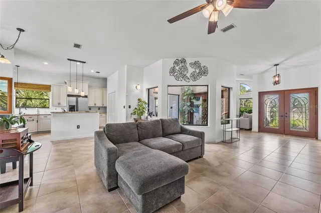 a living room with furniture and a large window