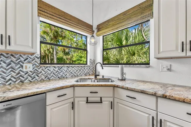 a kitchen with a sink and a window