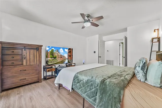 a bedroom with a bed and a dresser