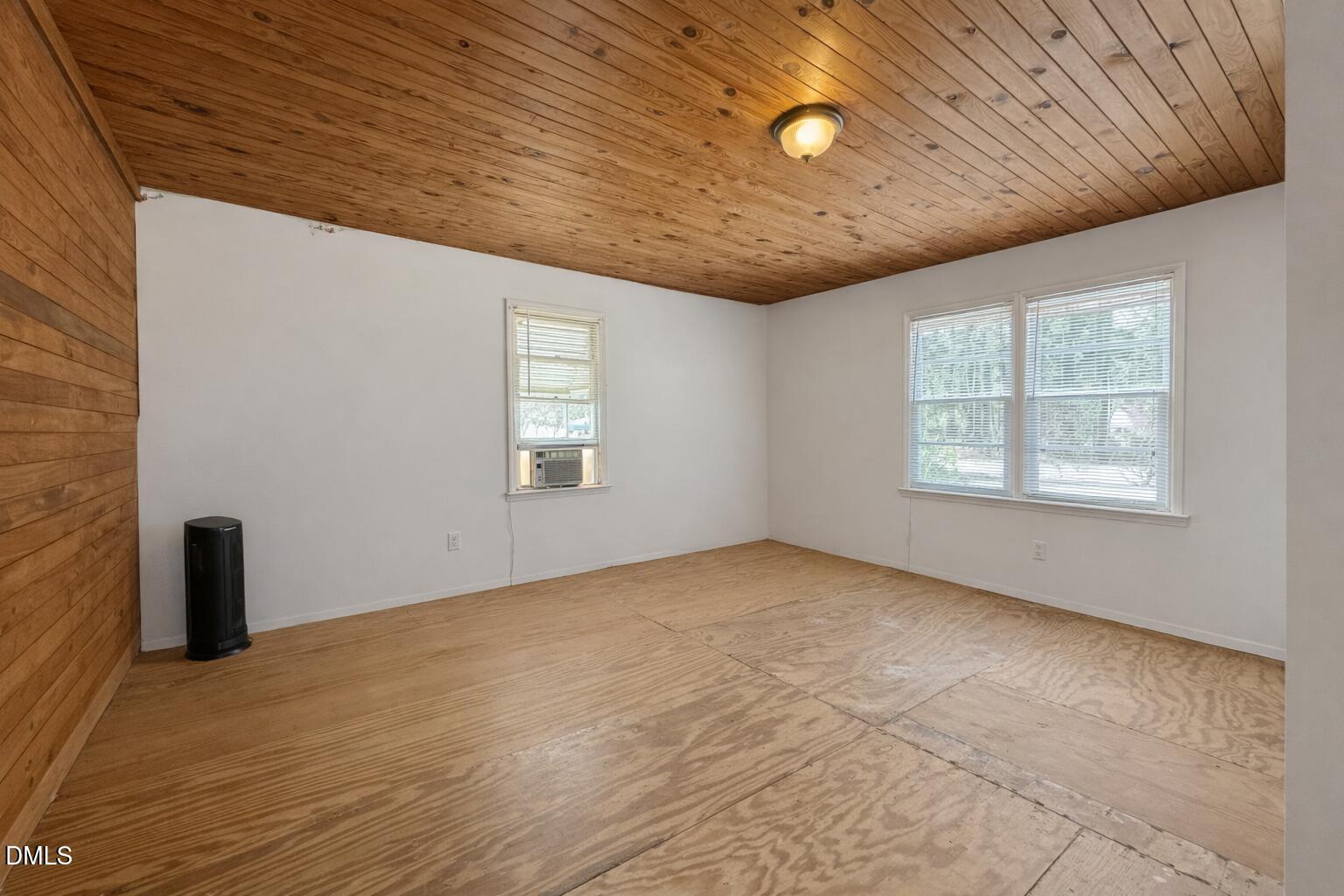829 Shaw's Pond Road Four Oaks, NC 27524 - Photo 12 of 30 an empty room with windows