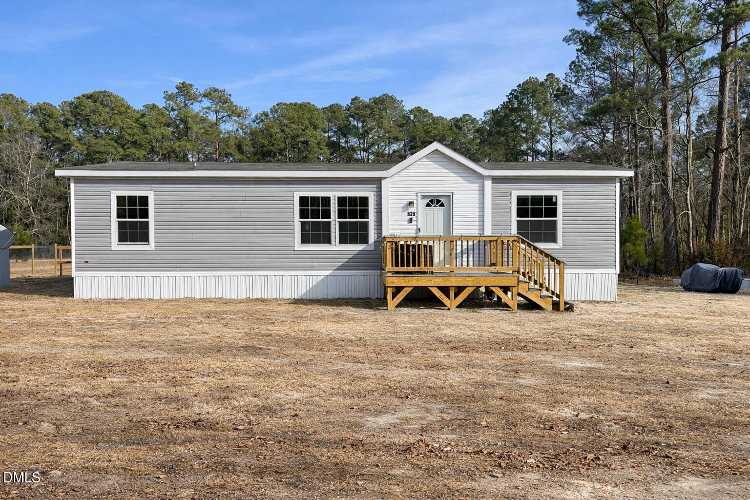 829 Shaw's Pond Road Four Oaks, NC 27524 - Photo 16 of 26 a view of a house with backyard and trees