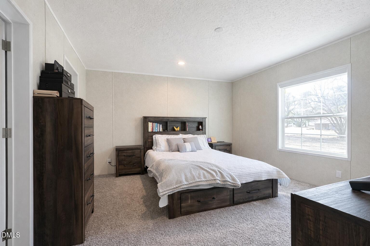 829 Shaw's Pond Road Four Oaks, NC 27524 - Photo 20 of 26 a bedroom with a bed and a window