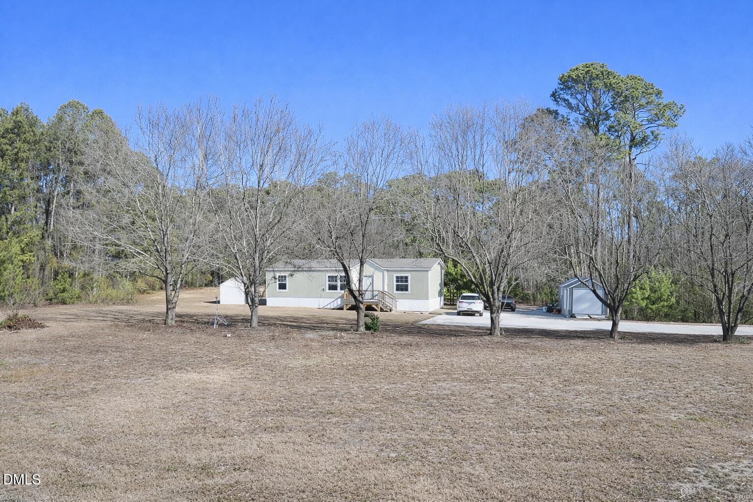 829 Shaw's Pond Road Four Oaks, NC 27524 - Photo 2 of 26 a view of road with trees