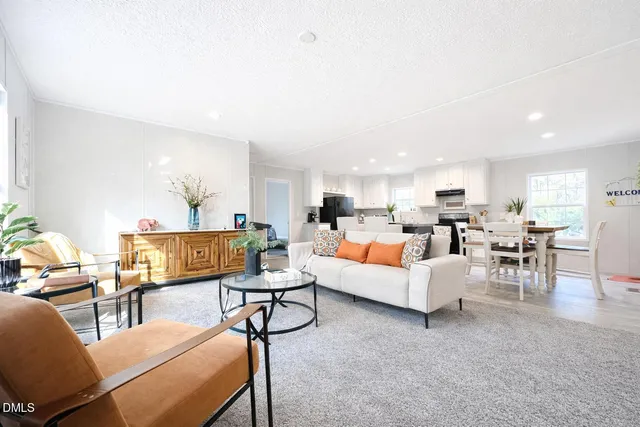 a living room with furniture and a table