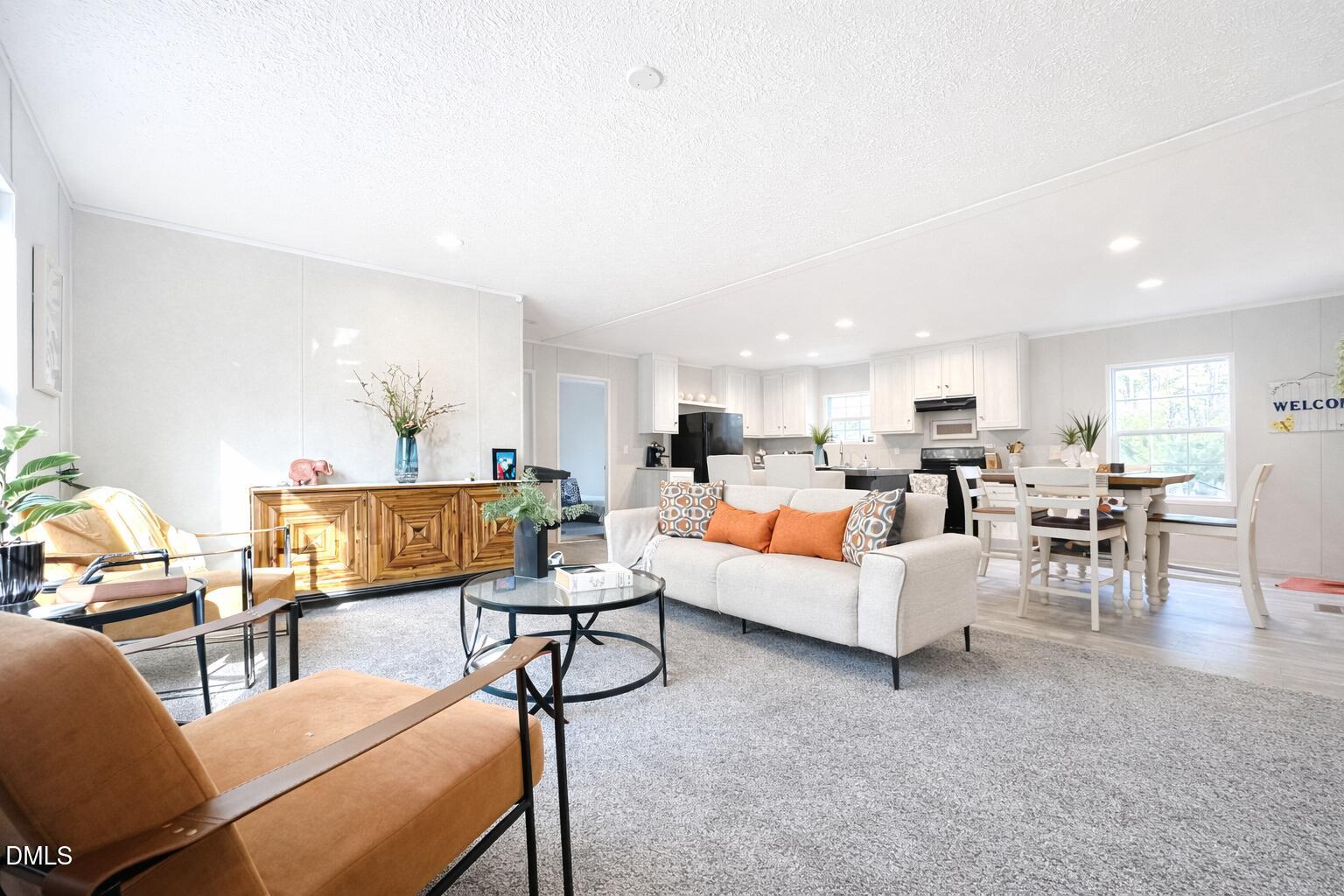 829 Shaw's Pond Road Four Oaks, NC 27524 - Photo 19 of 30 a living room with furniture and a table