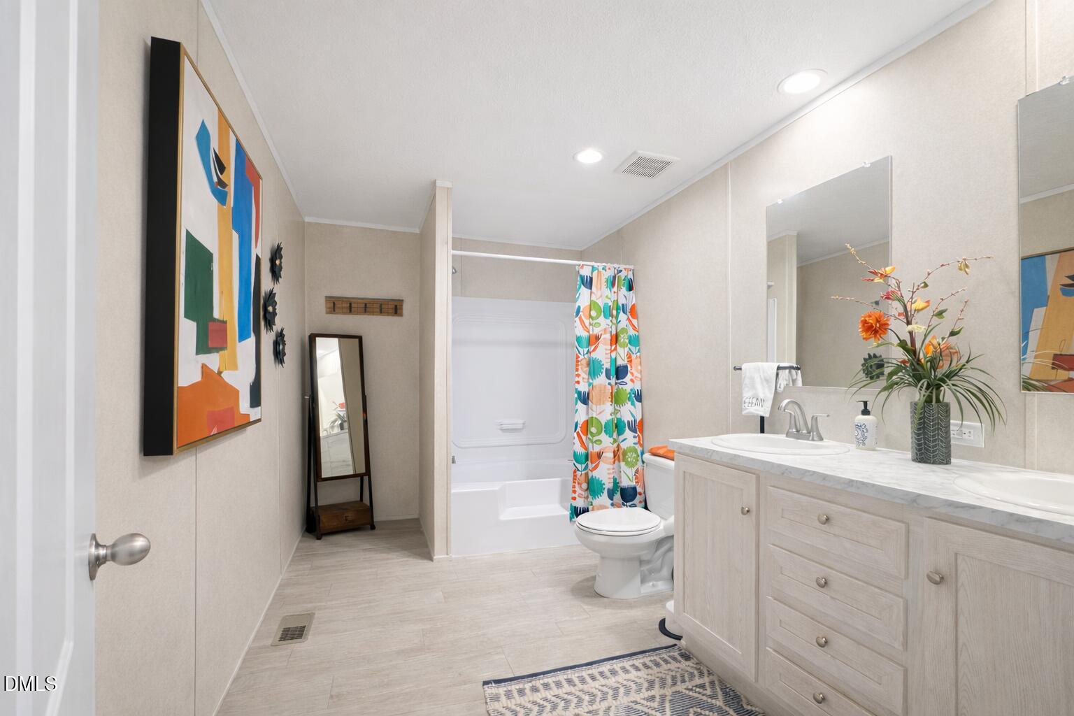 829 Shaw's Pond Road Four Oaks, NC 27524 - Photo 23 of 30 a bathroom with a sink toilet and shower